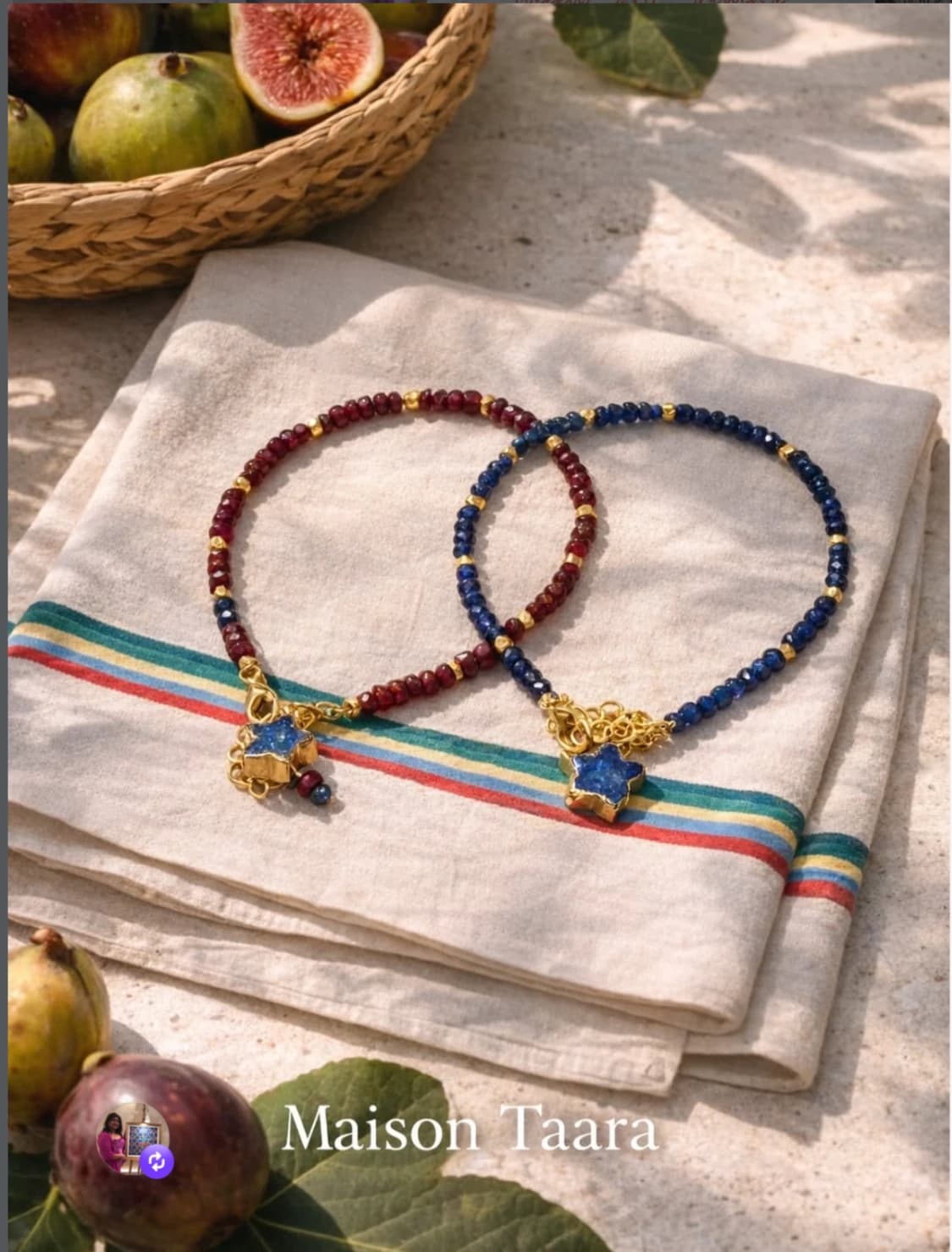 Maison Taara colourful beaded necklaces styled on folded cloth.